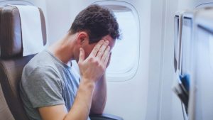 Should you recline your seat on an airplane? This guy doesn't have that problem.